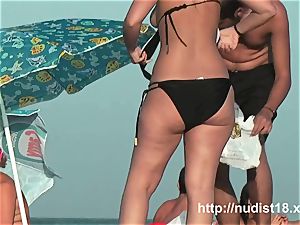 naked beach spycam video of red-hot playful nudists in water