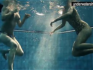 two fabulous amateurs showcasing their figures off under water